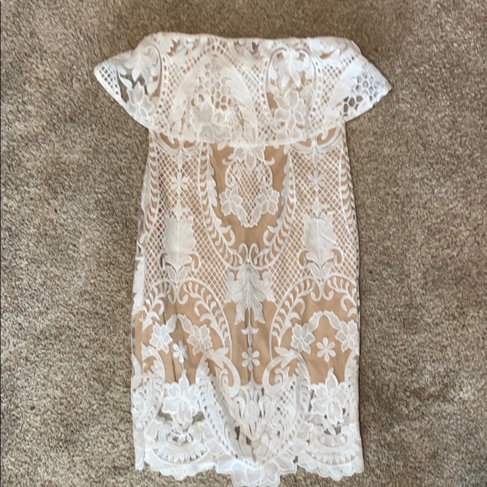 White lace dress with nude lining.